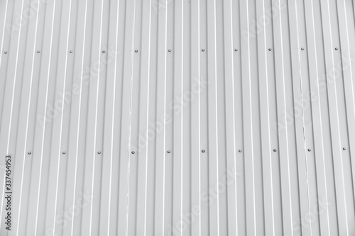 white metal siding on a wall as background