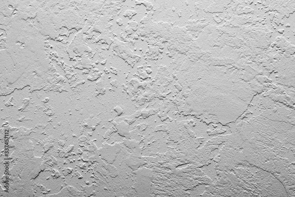 Light wall stucco, concrete with abstract spots Beautiful gray, white texture, abstract wall surface background Light wall stucco, concrete with abstract spots Beautiful gray, white texture, abstract wall surface background
