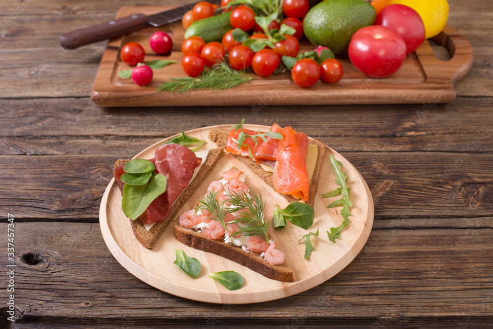 healthy sandwiches on wooden plate on old wooden table healthy sandwiches on wooden plate on old wooden table