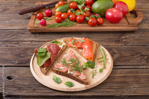 healthy sandwiches on wooden plate  on old wooden table