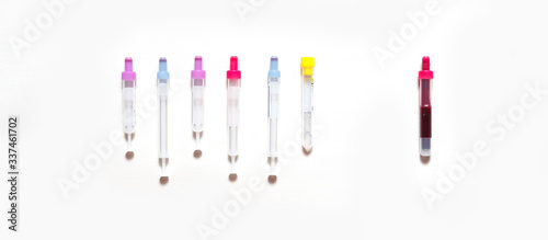Coronavirus. Blood test tubes for a virus test in the hands of a diagnostician doctor in blue medical gloves on a white background. Diagnosis concept covid19