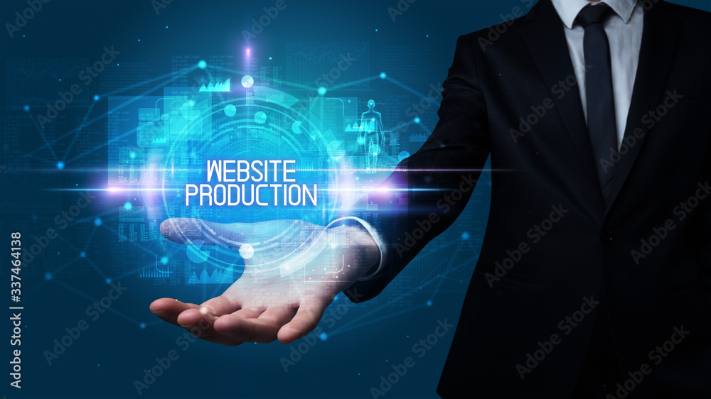 Man hand holding WEBSITE PRODUCTION inscription, technology concept Man hand holding WEBSITE PRODUCTION inscription, technology concept