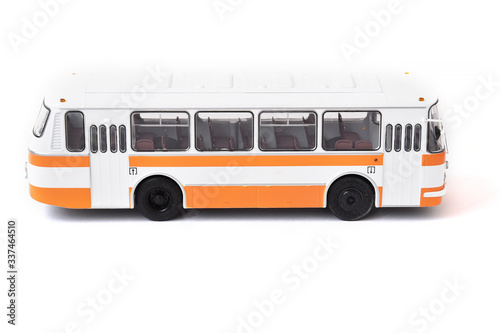 Scale model of a white yellow Russian bus. Toy yellow bus