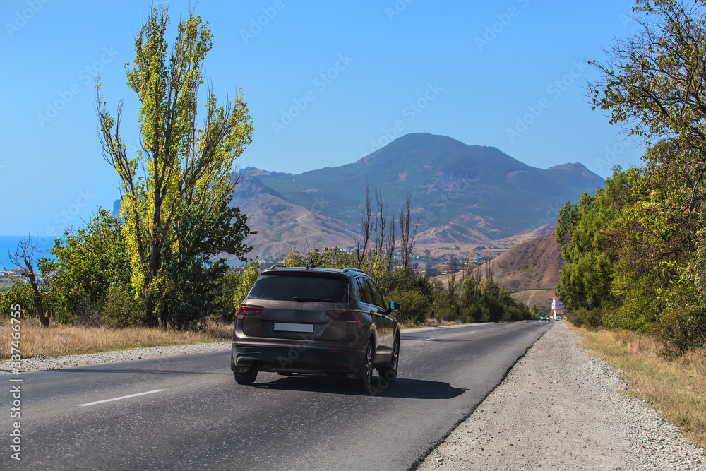 Crossover rides on the road by the sea Crossover rides on the road by the sea