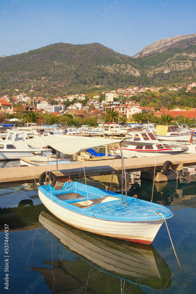 Fishing boats in harbor, beautiful Mediterranean landscape.  Montenegro, Adriatic Sea, Bay of Kotor. View of Marina Kalimanj in Tivat city