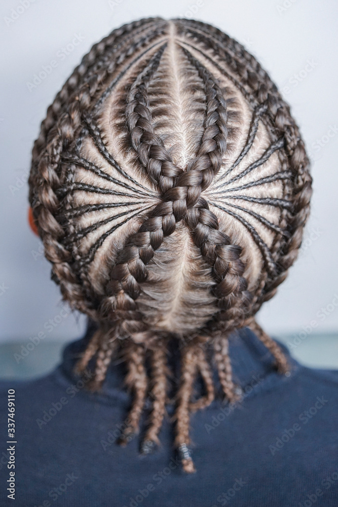 cornrows, plaits of the braids on the male head, underker cornrows, plaits of the braids on the male head, underker