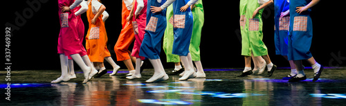 Children on stage dancing folk dances.
