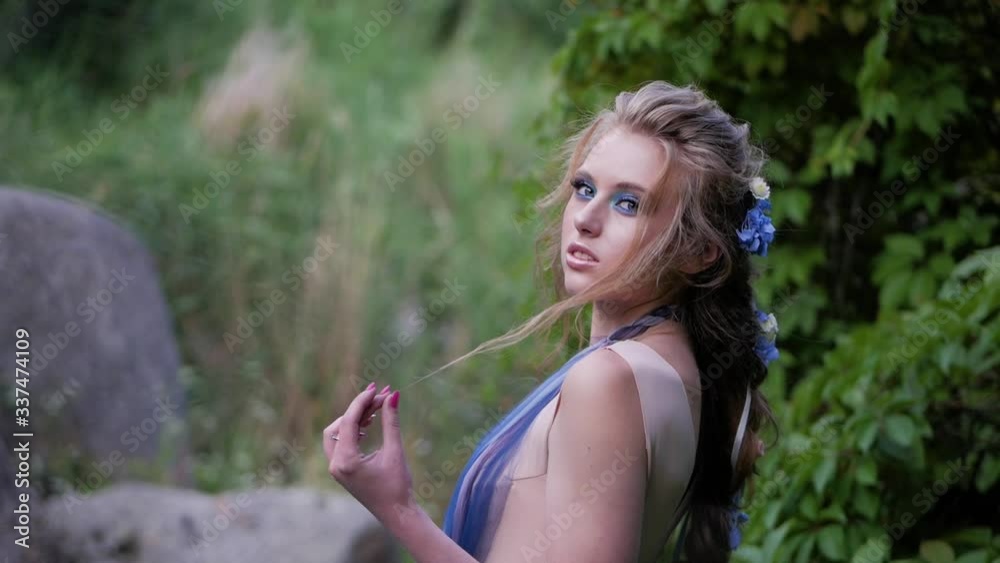 Close-up portrait of young cute girl looking at camera. Nature, beautiful people and summertime concept. Close-up portrait of young cute girl looking at camera. Nature, beautiful people and summertime concept.