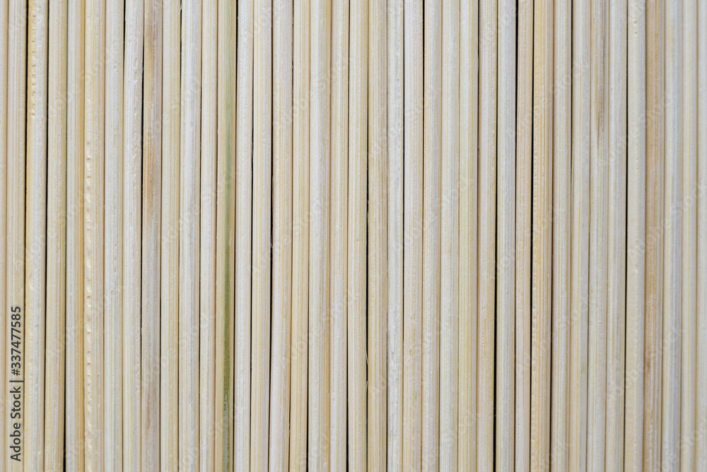 Fototapeta premium Set of vertical natural wooden sticks, background.