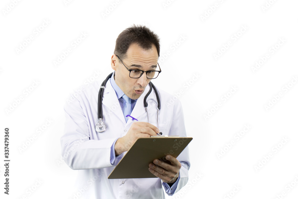 Shocked male senior age doctor in medical uniform and stethoscope checking patient's medical record on clipboard on isolated white background. Copy space. Medical report, history, diagnosis concept Shocked male senior age doctor in medical uniform and stethoscope checking patient's medical record on clipboard on isolated white background. Copy space. Medical report, history, diagnosis concept