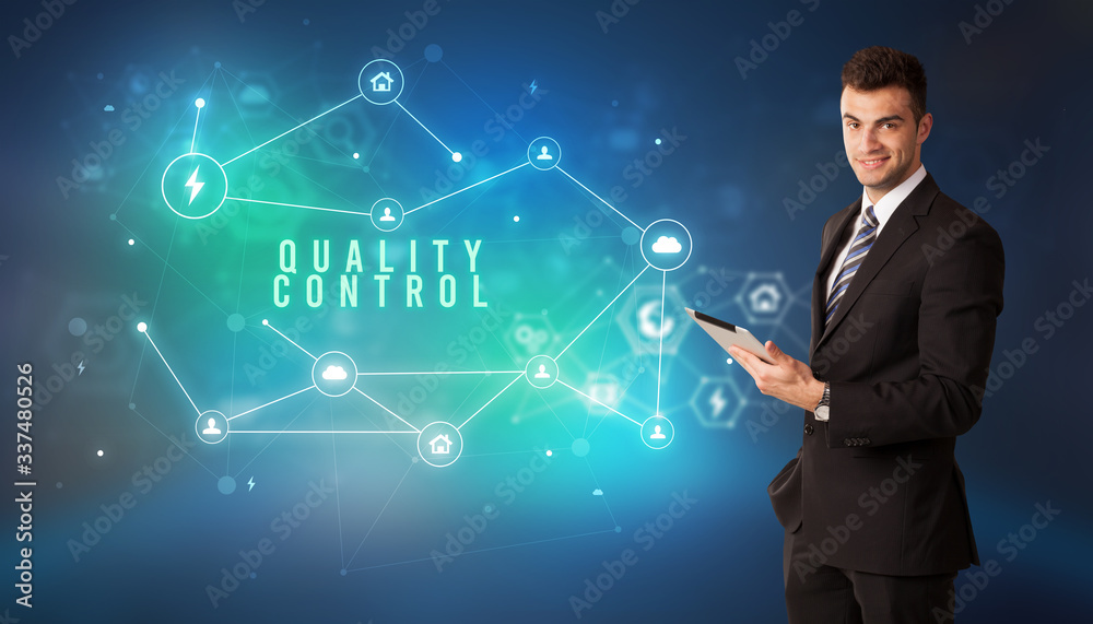 Businessman in front of cloud service icons with QUALITY CONTROL inscription, modern technology concept Businessman in front of cloud service icons with QUALITY CONTROL inscription, modern technology concept
