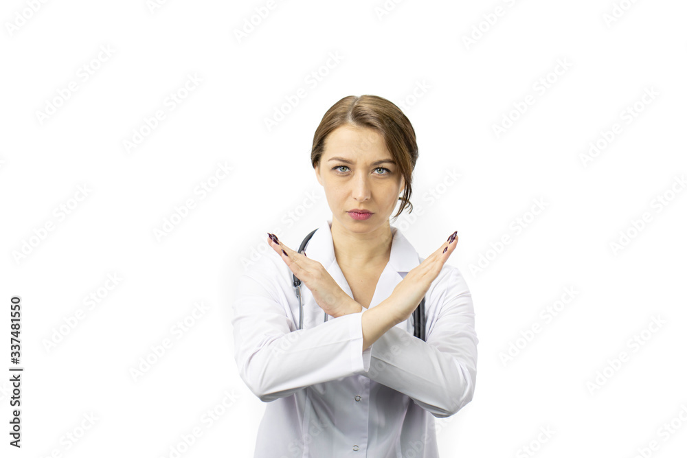 Beautiful young female doctor in white medical coat and stethoscope doing stop sign, sign of prohibition with serious and confident expression, defense gesture, isolated white background, tabu concept Beautiful young female doctor in white medical coat and stethoscope doing stop sign, sign of prohibition with serious and confident expression, defense gesture, isolated white background, tabu concept