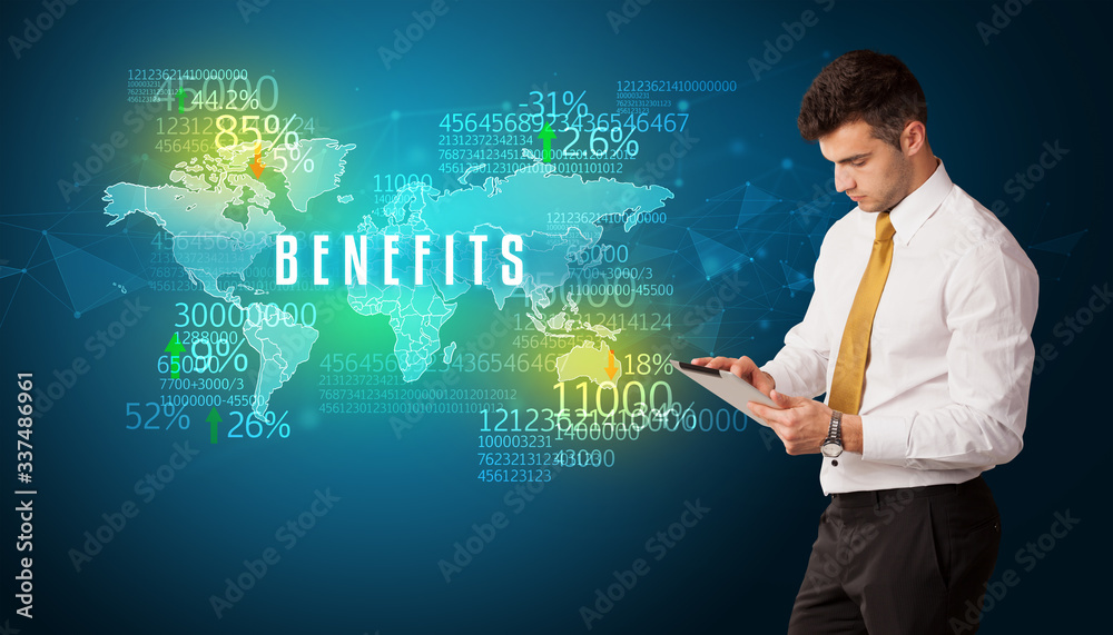 Businessman in front of a decision with BENEFITS inscription, business concept Businessman in front of a decision with BENEFITS inscription, business concept
