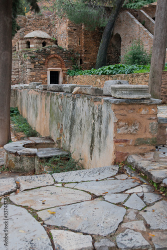 Ruins of ancient monastery of Kesariani in mountains near Athens, Greece photo