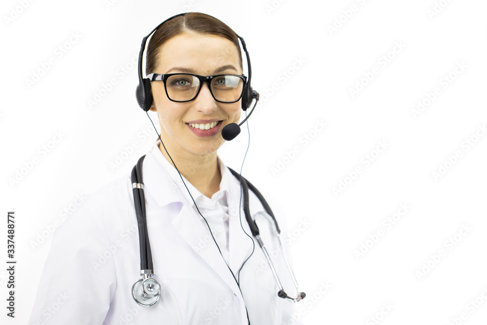 Close up portrait of beautiful sexy female doctor in white coat and headphones smiling and looking at camera. Isolated white background, copy space. Medical consulting company, online patient support Close up portrait of beautiful sexy female doctor in white coat and headphones smiling and looking at camera. Isolated white background, copy space. Medical consulting company, online patient support