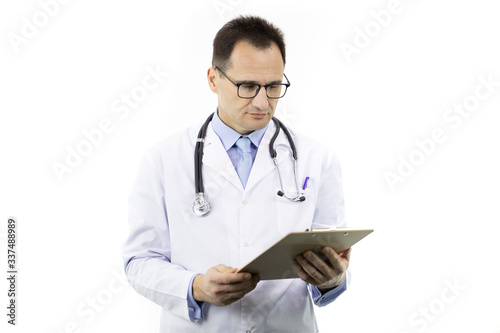 Handsome serious male senior age doctor in white coat and stethoscope checking patient's medical diagnosis on clipboard on isolated white background. Copy space. Healthcare, insurance, medical concept