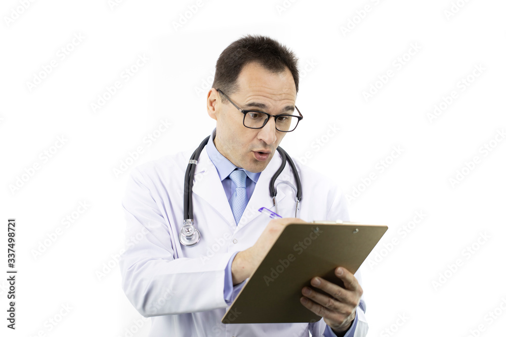 Surprised male senior age physician in medical coat and stethoscope checking patient's medical record on clipboard on isolated white background. Copy space. Medical report, history, diagnosis concept Surprised male senior age physician in medical coat and stethoscope checking patient's medical record on clipboard on isolated white background. Copy space. Medical report, history, diagnosis concept