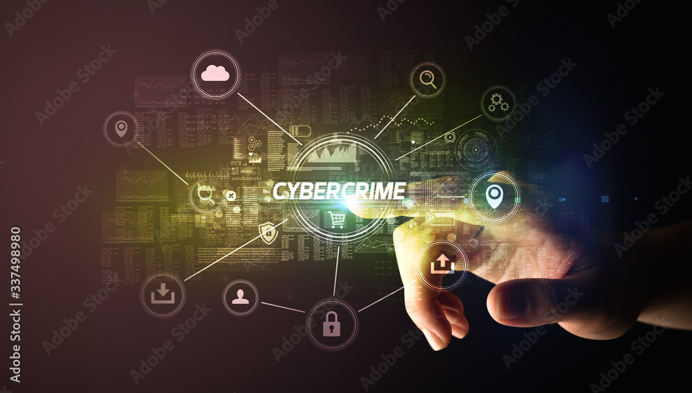 Hand touching CYBERCRIME inscription, Cybersecurity concept Hand touching CYBERCRIME inscription, Cybersecurity concept