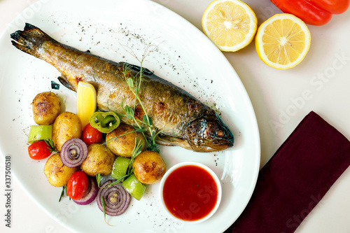 rainbow trout with grilled vegetables and citrus sauce