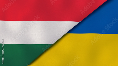 The flags of Hungary and Ukraine. News, reportage, business background. 3d illustration