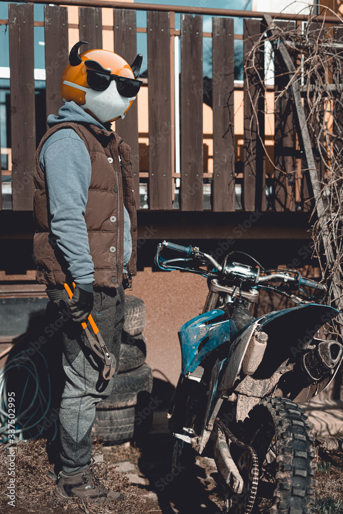 Emoji motocross rider with fancy black nerd sunglasses, preparing his  motorcycle for a race before season. Emoji with mask protecting against  coronavirus – Covid 19. 3D rendering and photography colla Photos | Adobe  Stock