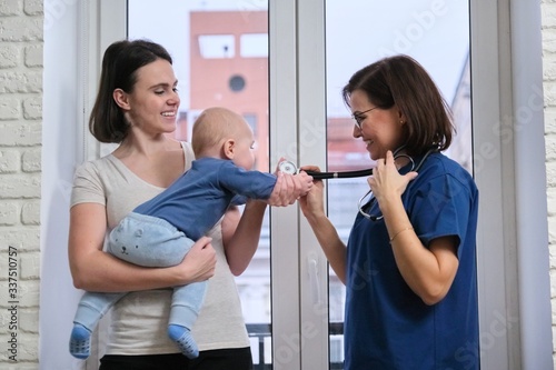Visit of doctor pediatrician home, mother with baby son talking with doctor