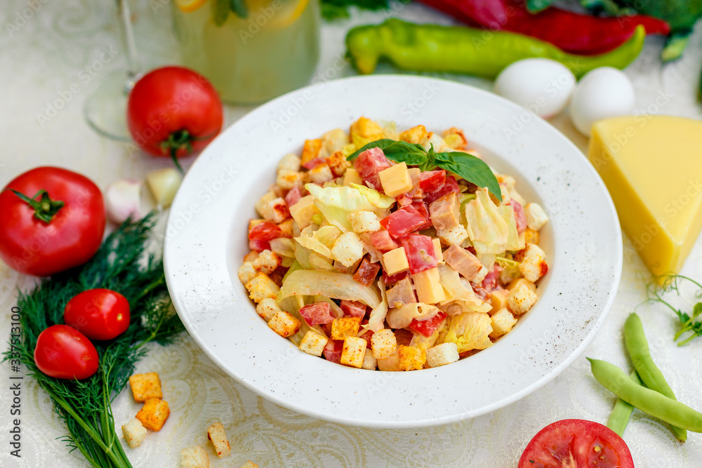 fresh salad with chicken, cheese, rusks, lettuce and tomatoes fresh salad with chicken, cheese, rusks, lettuce and tomatoes