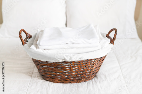 Neatly folded laundry in a laundry basket