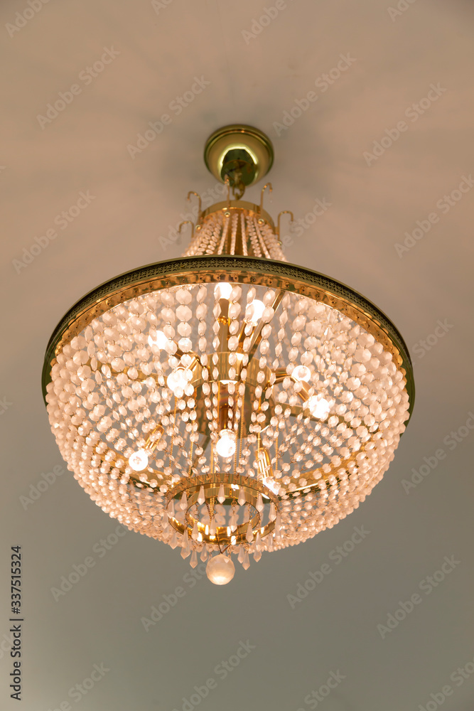 Obraz premium Simple chandelier on the ceiling