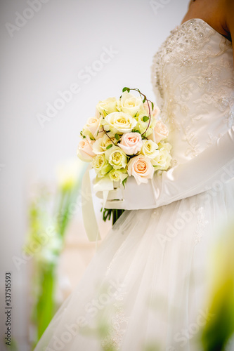 wedding bouquet in hands of bride