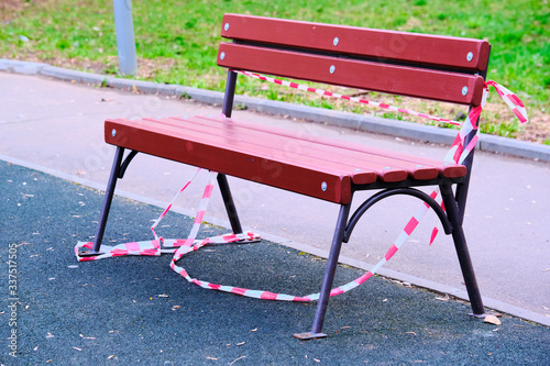 bench with the fence's ribbon torn off