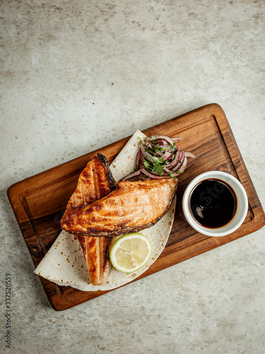 fried salmon with onions lemon and narsharab photo