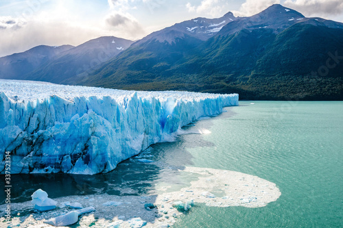 Ice collapsing into the water at Perito Moreno Glacier in Los Glaciares National Park near El Calafate, Patagonia Argentina, South America. photo