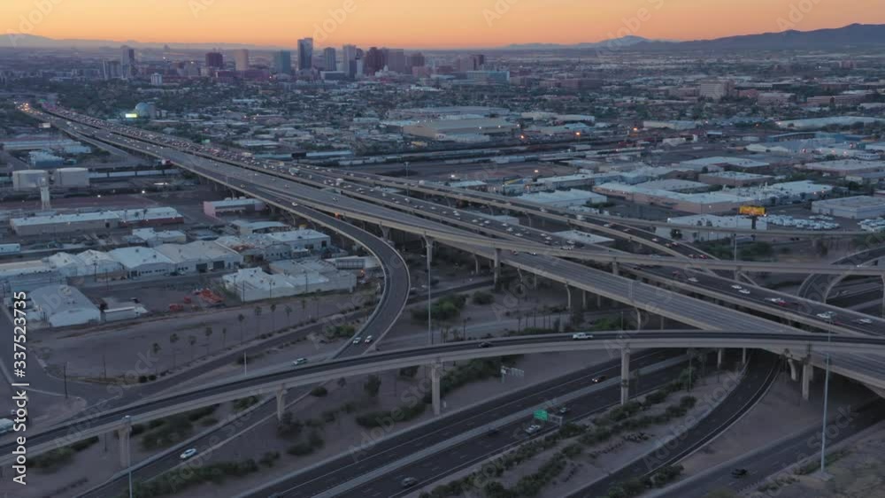 Aerial: Rush hour freeway traffic on Interstate at sunrise. Phoenix, Arizona, USA Aerial: Rush hour freeway traffic on Interstate at sunrise. Phoenix, Arizona, USA