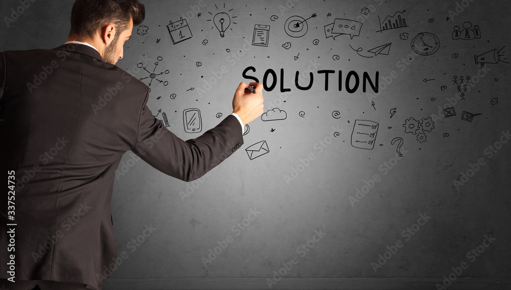 businessman drawing a creative idea sketch with SOLUTION inscription, business strategy concept businessman drawing a creative idea sketch with SOLUTION inscription, business strategy concept