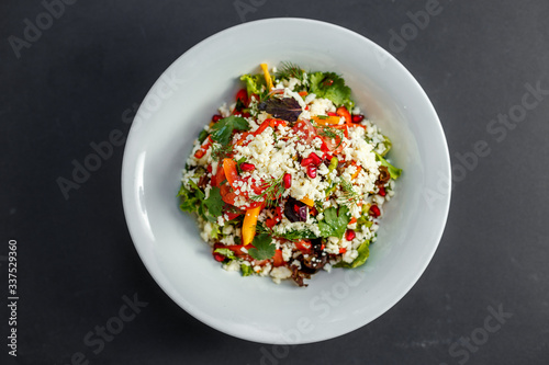 vegetarian salad healthy food with pomegranate cheese and pepper