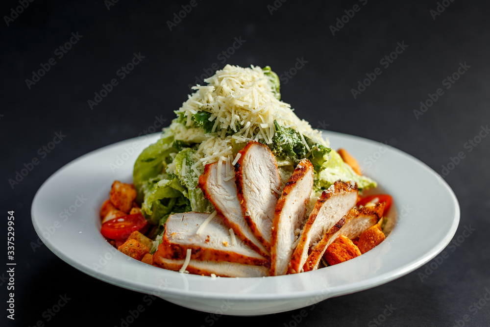 Caesar salad with chicken and crackers Caesar salad with chicken and crackers