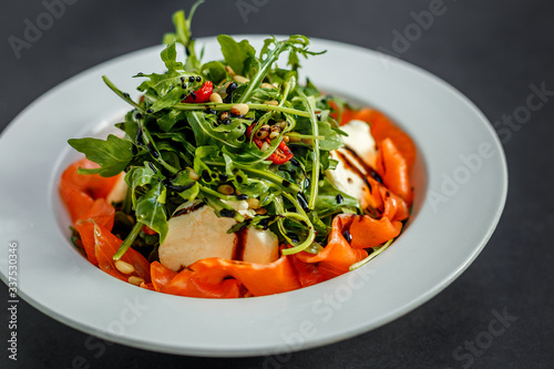 salad with fresh fish arugula and cheese