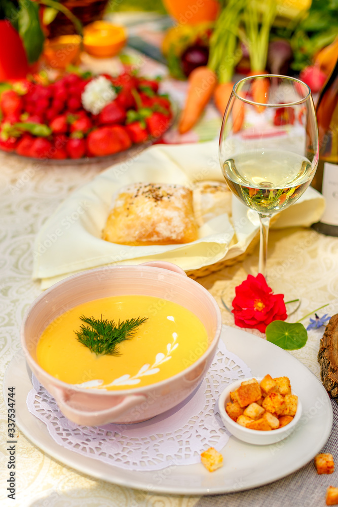 cheese soup with crackers on the holiday table