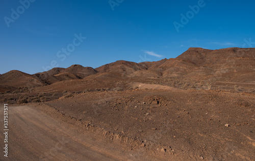 panorama of mountains overlooking the sea in the desert on the Atlantic coast of the island of Fuerteventura. Las Playitas  october 2019
