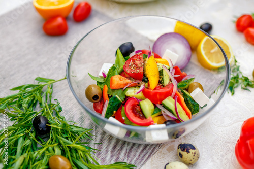 fresh vegetarian salad with greens and vegetables on the table, healthy food