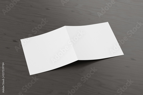 Blank square pages leaflet cover on black wooden background. Bi-fold or half-fold opened brochure isolated with clipping path. Side view. 3d illustration © dimamoroz