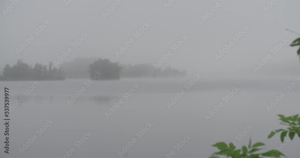 Foggy small island in a lake 