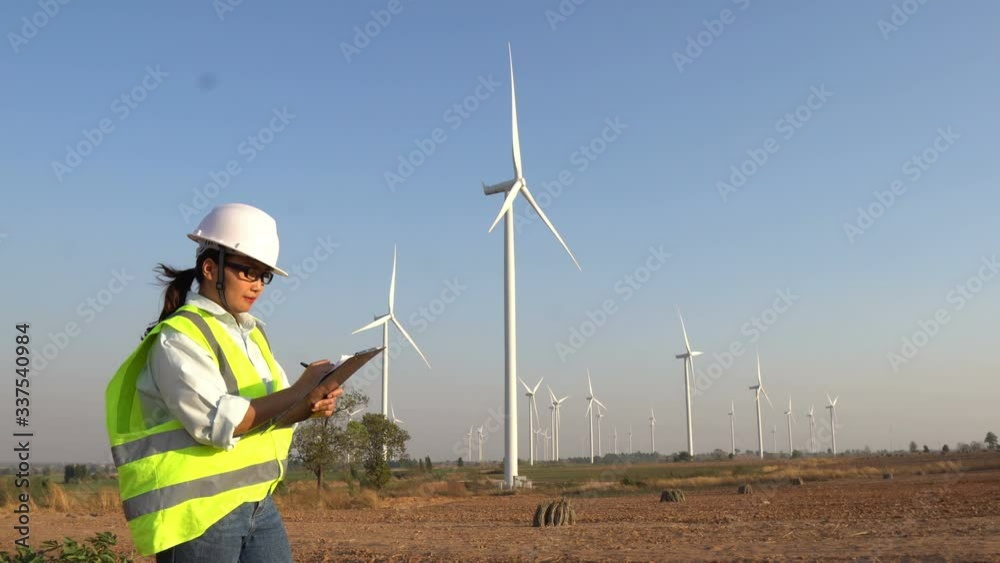 custom made wallpaper toronto digitalEngineer working and holding the report at wind turbine farm Power Generator Station on mountain,Thailand people