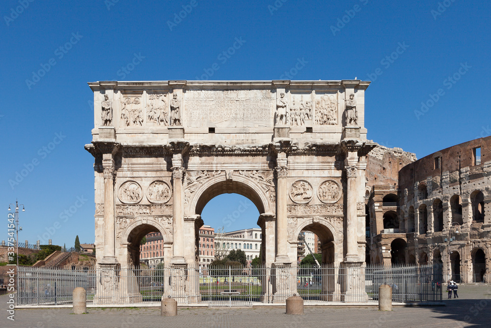The Arch of Constantine (Arco di Costantino). .Triumphal arch and Colosseum on background. Rome, Italy