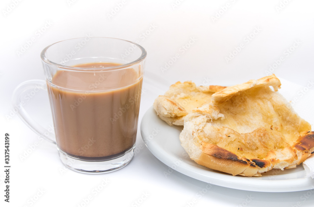 Popular brazilian bread with melted butter called pao na chapa. Pao na chapa traditional brazilian breakfast. Glass of hot coffee with milk called pingado. Popular brazilian bread with melted butter called pao na chapa. Pao na chapa traditional brazilian breakfast. Glass of hot coffee with milk called pingado.