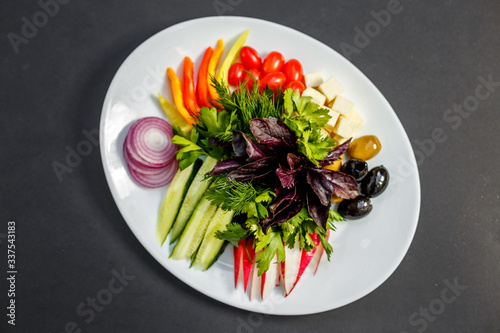 vegetable slices, cheese, tomatoes, peppers, greens, radishes, onions, cucumbersand olives, healthy food, isolated