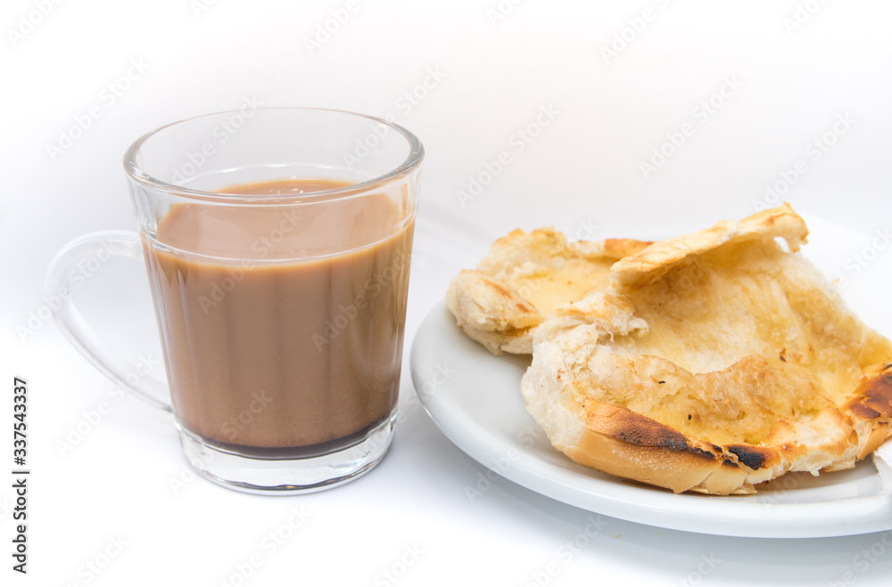 Popular brazilian bread with melted butter called pao na chapa. Pao na chapa traditional brazilian breakfast. Glass of hot coffee with milk called pingado. Popular brazilian bread with melted butter called pao na chapa. Pao na chapa traditional brazilian breakfast. Glass of hot coffee with milk called pingado.