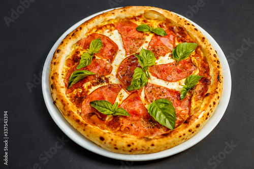 hot italian pizza with cheese and basil, isolated