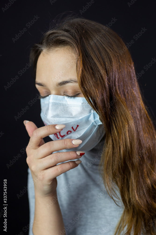 Portrait of Coughing up blood lung disease woman scared of Coronavirus in protective mask with 2019-ncov written. medical mask against viruses and infections isolated studio. covid-19 concept. Portrait of Coughing up blood lung disease woman scared of Coronavirus in protective mask with 2019-ncov written. medical mask against viruses and infections isolated studio. covid-19 concept.